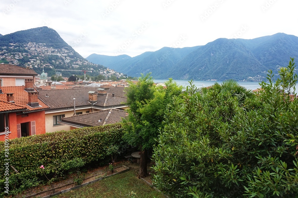 Panorama of the city and Lake Lugano from the observation deck near the station.