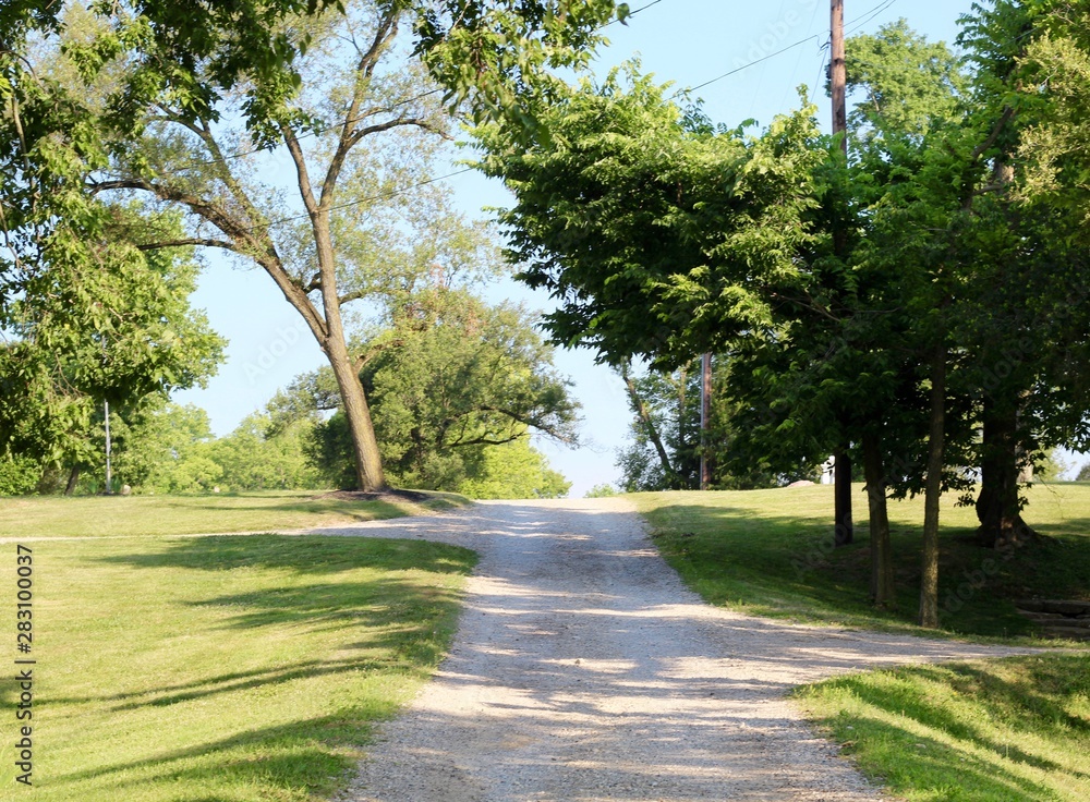 The gravel road in the countryside on a sunny day. The gravel road in the countryside on a sunny day.