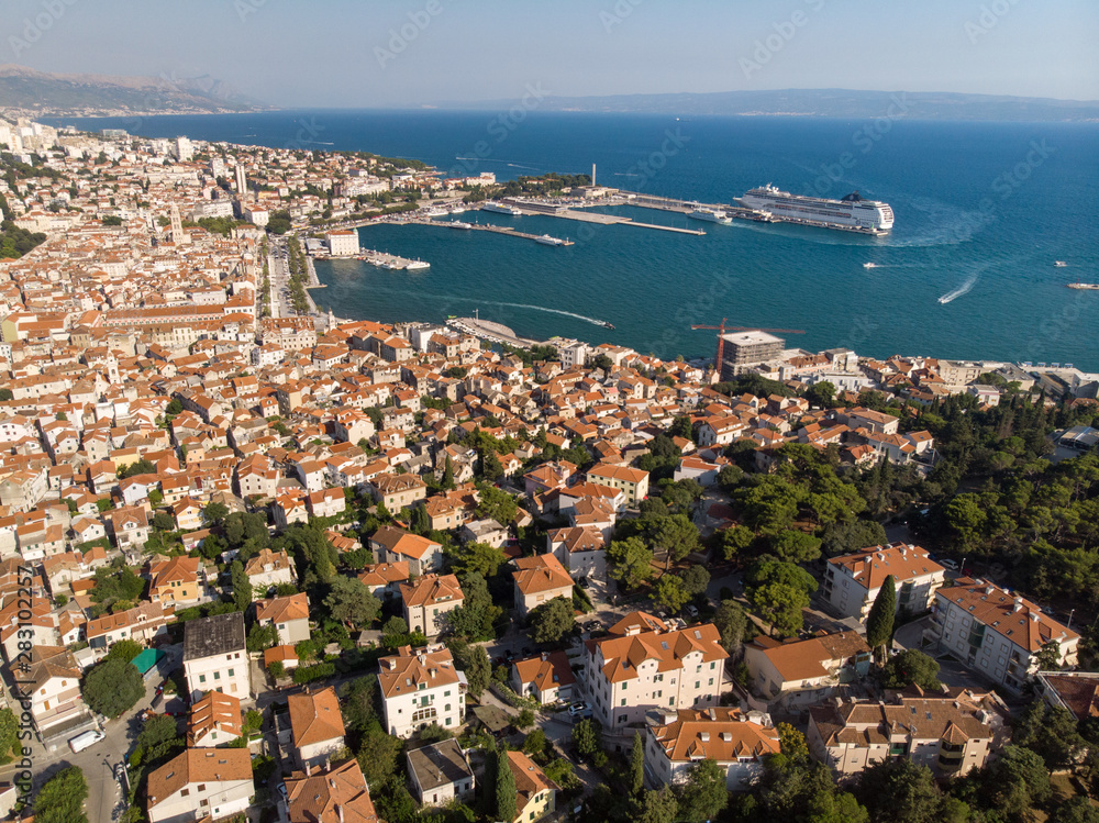 Split, Croatia, august 2019: Aerial view of Split city, Diocletian Palace and Mosor mountains in background. Split panoramic view of town, UNESCO World Heritage