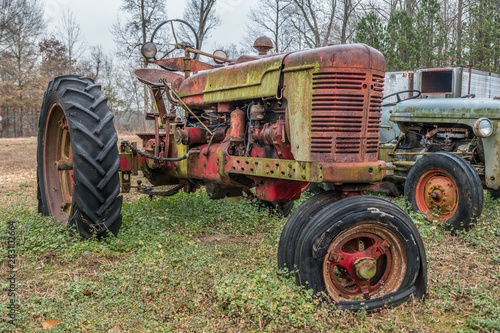 Farm tractor abandoned in field