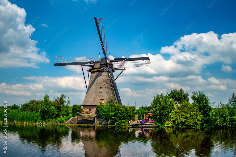 Picturesque scene with a traditional Dutch windmill for water management in Kinderdijk, Netherlands.