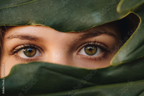 Photography young girl with green eyes in the forest