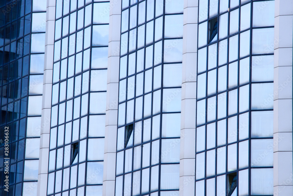 A high-rise office building. Some windows opened. A high-rise office building. Some windows opened.