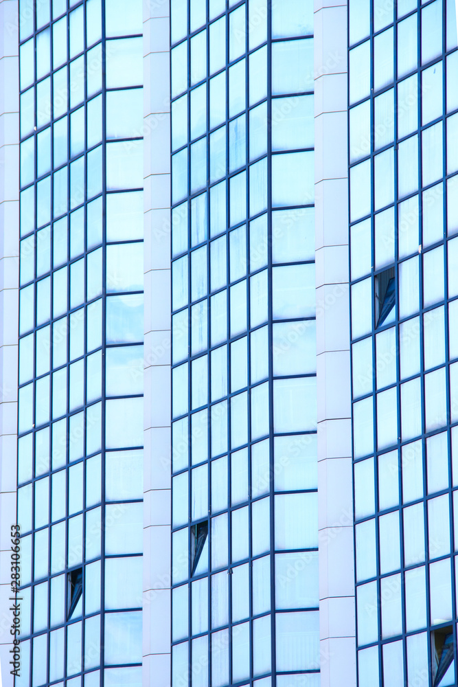 A high-rise office building. Some windows opened. A high-rise office building. Some windows opened.