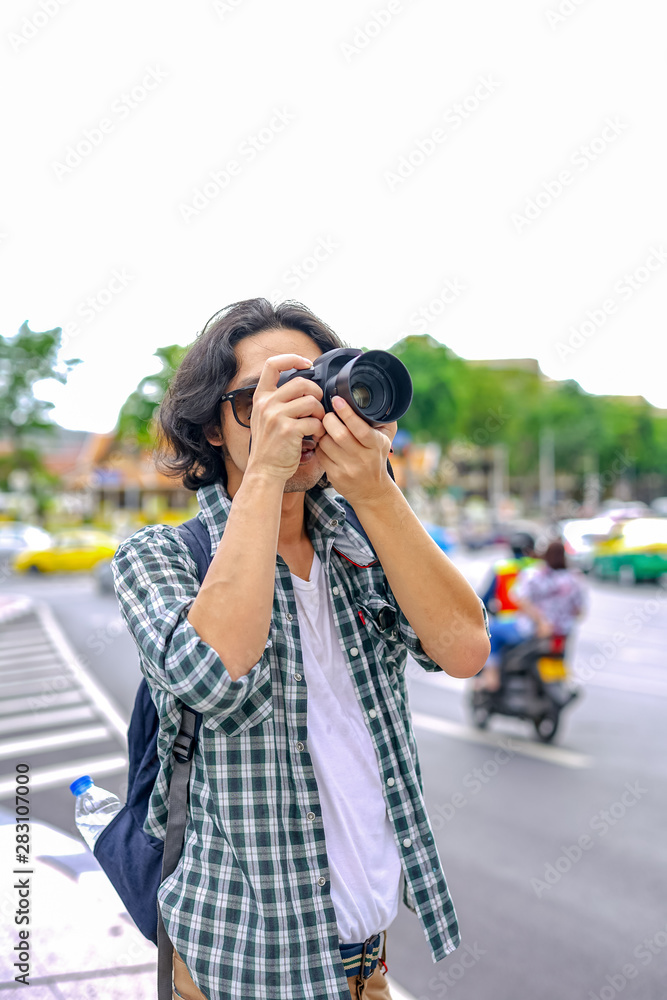 Man taking photo with digital camera
