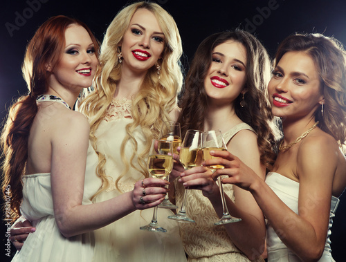 lifestyle, party and people concept - Group of partying girls clinking flutes with sparkling wine