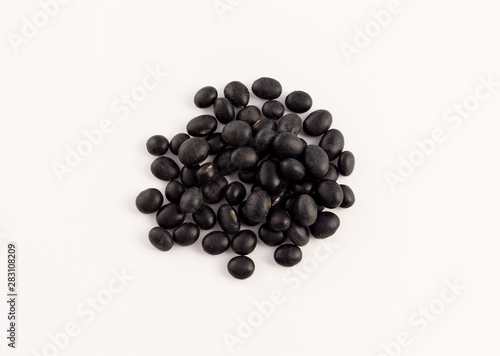 group of dried black beans on white background