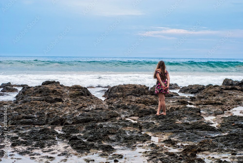 girl looking at the sea