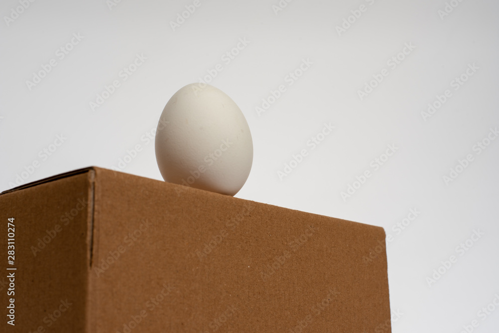 egg standing on the box egg standing on the box
