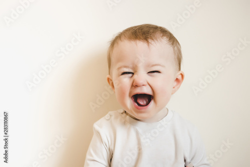 Obraz na plátne Baby with flu laughing