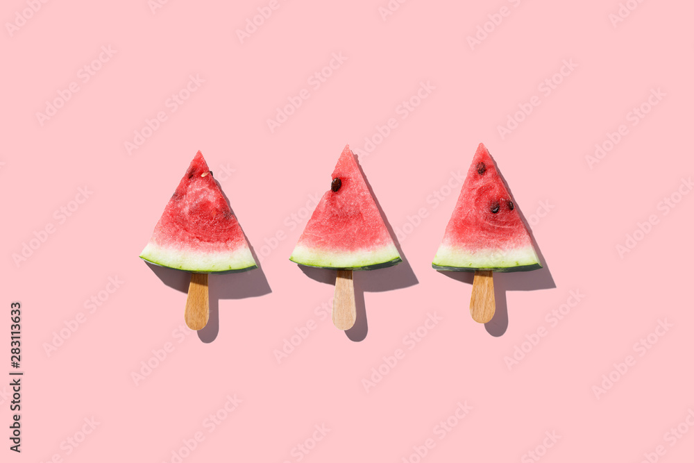 Flat lay top view of fresh watermelon slices on color background.