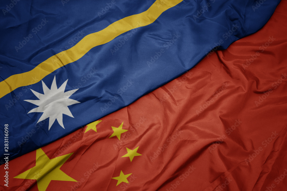 waving colorful flag of china and national flag of Nauru. waving colorful flag of china and national flag of Nauru.