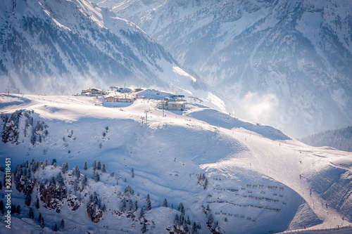 Mayrhofen, Austria Cafes and restaurants on a stop on the Penkenbahn lift on a background of snowy slopes photo