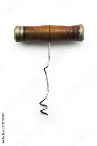 Antique vintage corkscrew on white background
