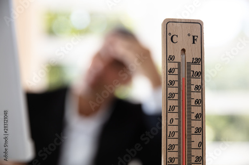 Obraz na plátne Businessman Working During Hot Weather