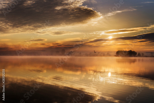 Golden sunrise over a lake in Bashkiria.