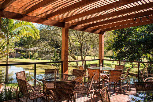 wood pergola and tables in garden farm