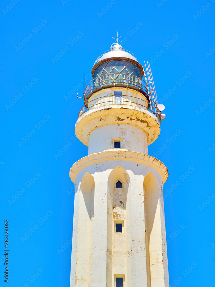 Trafalgar Lighthouse in The Cabo de Trafalgar Cape Natural Park. Barbate, Los Caños de Meca, Cadiz. Andalusia, Spain.