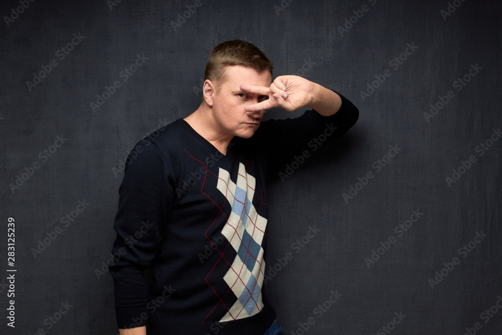 Portrait of confident young man posing elegantly