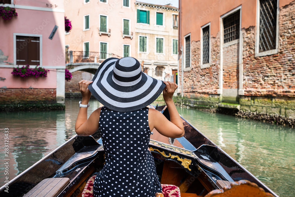 Female Riding In Gondola, Venice, Italy