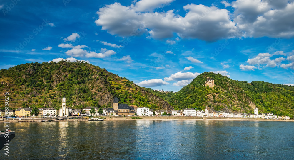 View to river Rhine from Boppard town at beautiful summer day. Hilltop castle and houses on the side of Rhine River in Germany. Rhine Valley is UNESCO World Heritage Site.