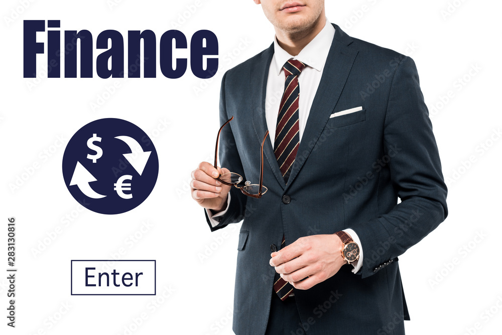 cropped view of businessman in suit holding glasses near finance lettering on white cropped view of businessman in suit holding glasses near finance lettering on white