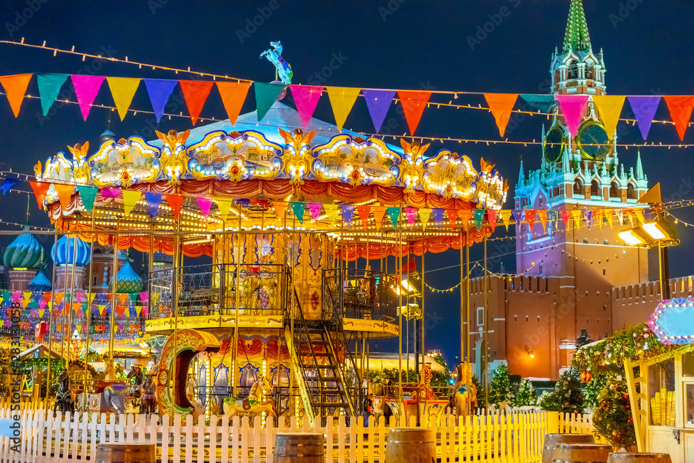 Moscow Russia. Carousel on the Red Square. Playground on the Red Square. Children's attraction decorated for Christmas.New Year celebrations in Moscow.Christmas atractions in the Russian Federation.