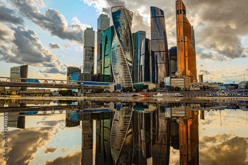 Moscow. The business center of the capital of Russia. Evening city with clouds. Moscow City. Walk along the Presnenskaya embankment at sunset. Russian architecture. High-rise buildings in Moscow photo