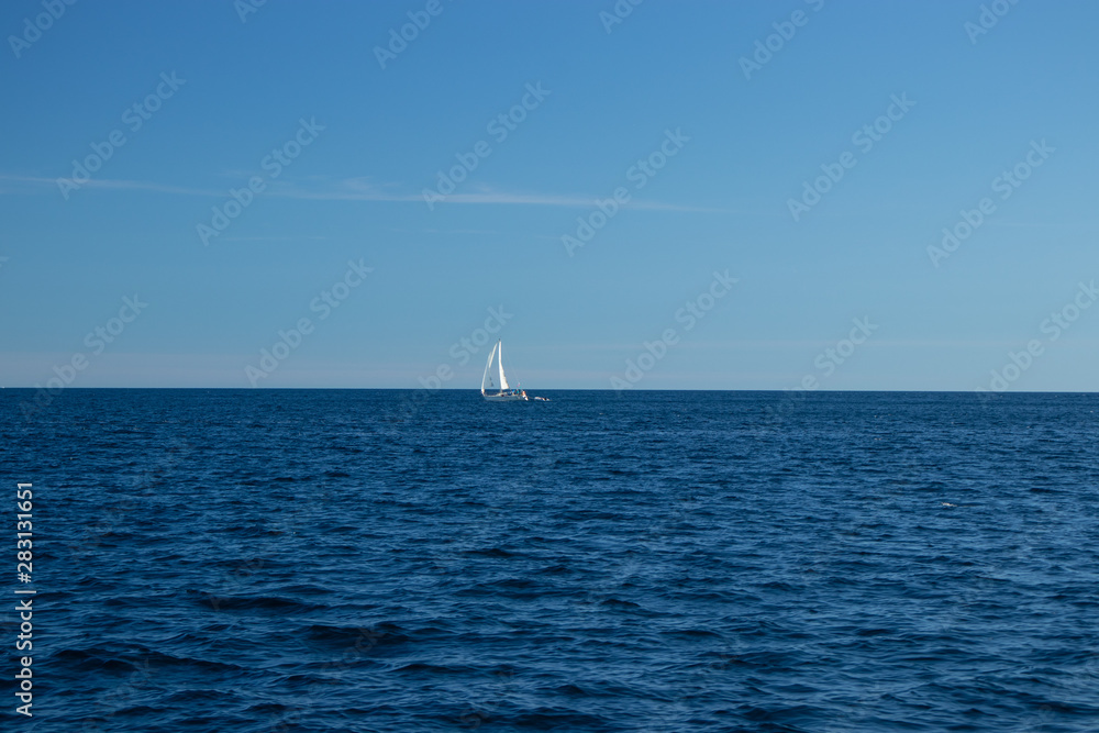 Sail boat in the middle of the Lake Huron, ON