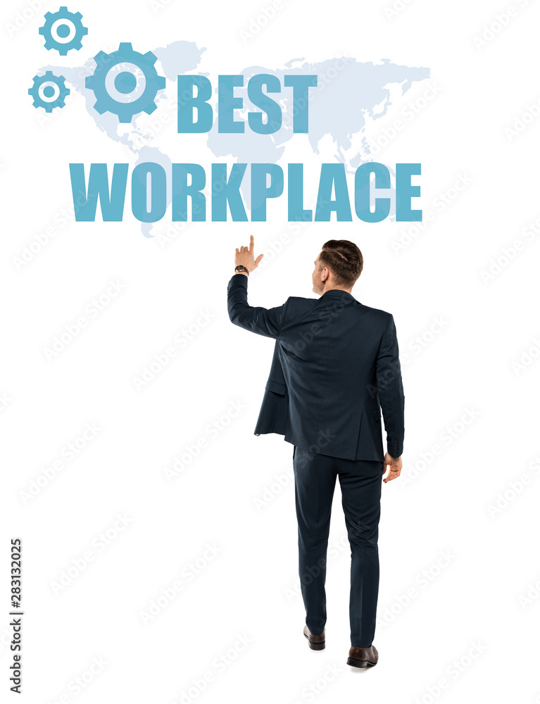 back view of man pointing with finger at best workplace lettering while standing isolated on white back view of man pointing with finger at best workplace lettering while standing isolated on white