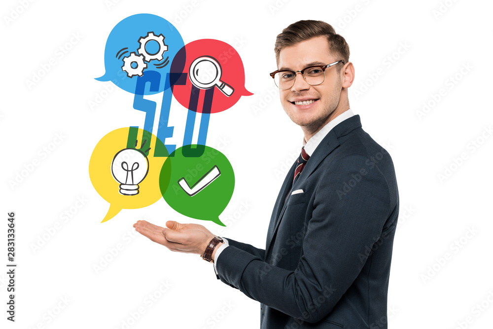happy businessman in glasses gesturing and smiling near seo lettering on white happy businessman in glasses gesturing and smiling near seo lettering on white