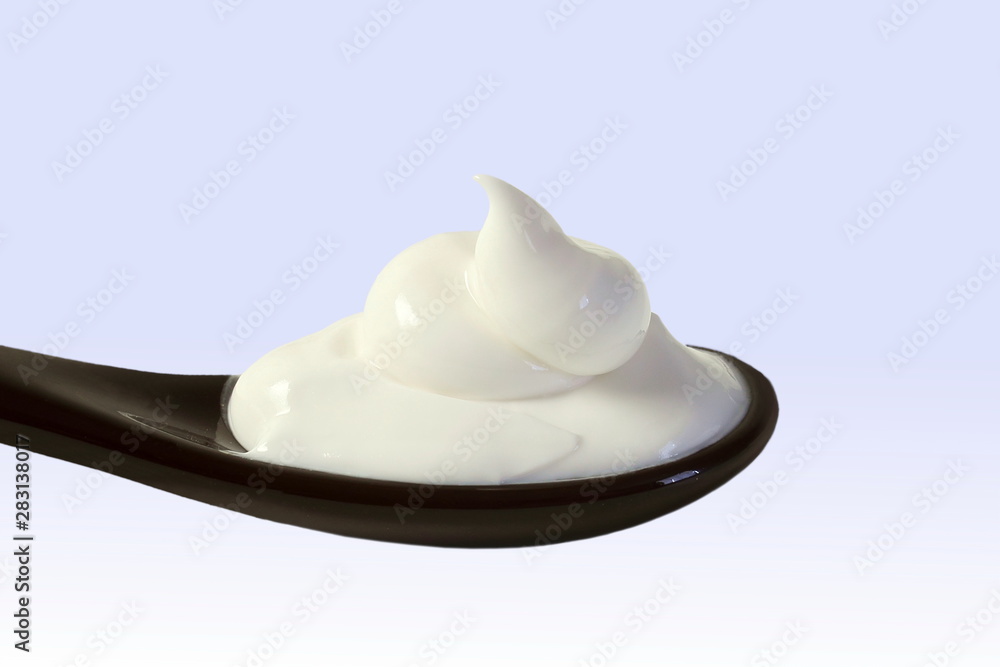 close up of skin care cosmetic beauty cream or lotion in spoon isolated on blur background with Copy space close up of skin care cosmetic beauty cream or lotion in spoon isolated on blur background with Copy space