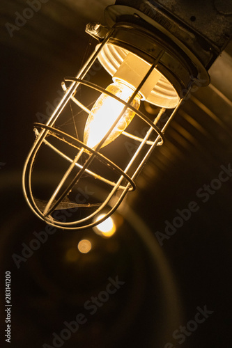 light bulb closeup of light bulb in underground tunnel