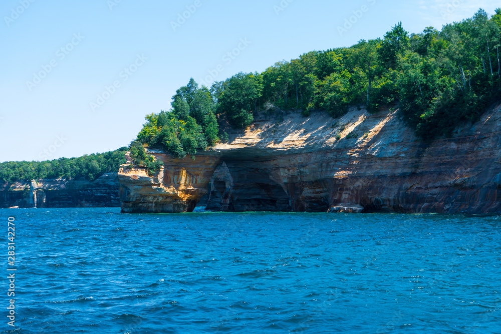 view from the lake at beautiful rocky cliff and forest , Pictured Rocks National Lakeshore view from the lake at beautiful rocky cliff and forest , Pictured Rocks National Lakeshore