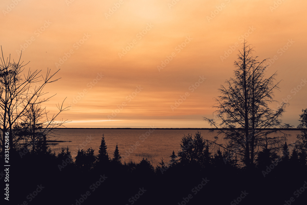 Fototapeta premium beautiful warm summer pink sunset by the Lae Michigan