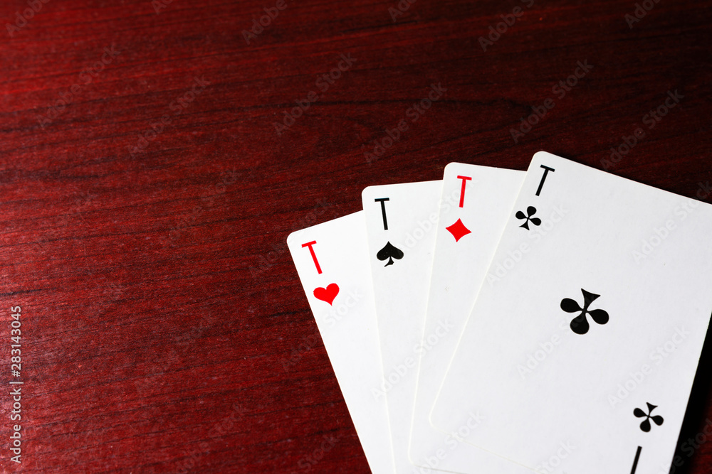 Obraz premium Game cards on the table, table texture red