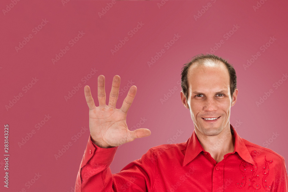 Portrait of happy smiling man showing five fingers, isolated on background punch shade pink Portrait of happy smiling man showing five fingers, isolated on background punch shade pink