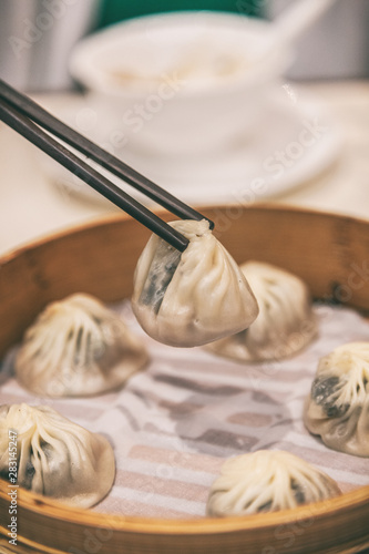 Chinese restaurant eating xiao long bao dumplings steamed soup dumpling asia travel. Shanghai city travel lifestyle.