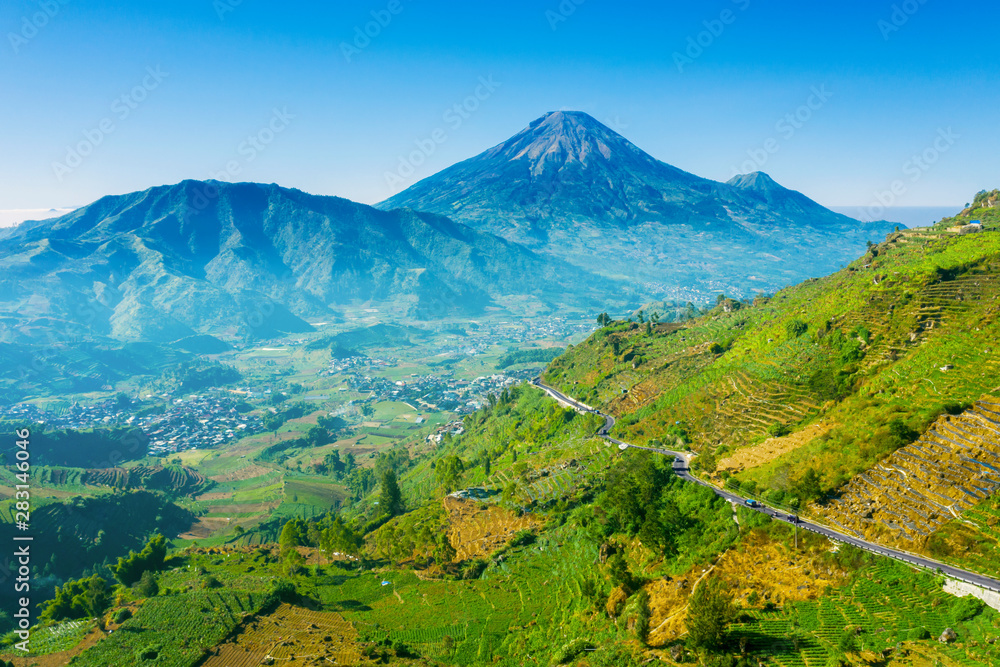 Fototapeta premium Aerial view of Dieng Plateau with Mount Sindoro