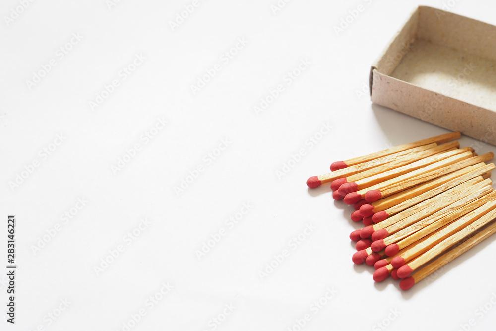 Obraz premium Matches in open match-box on Copy space and white background