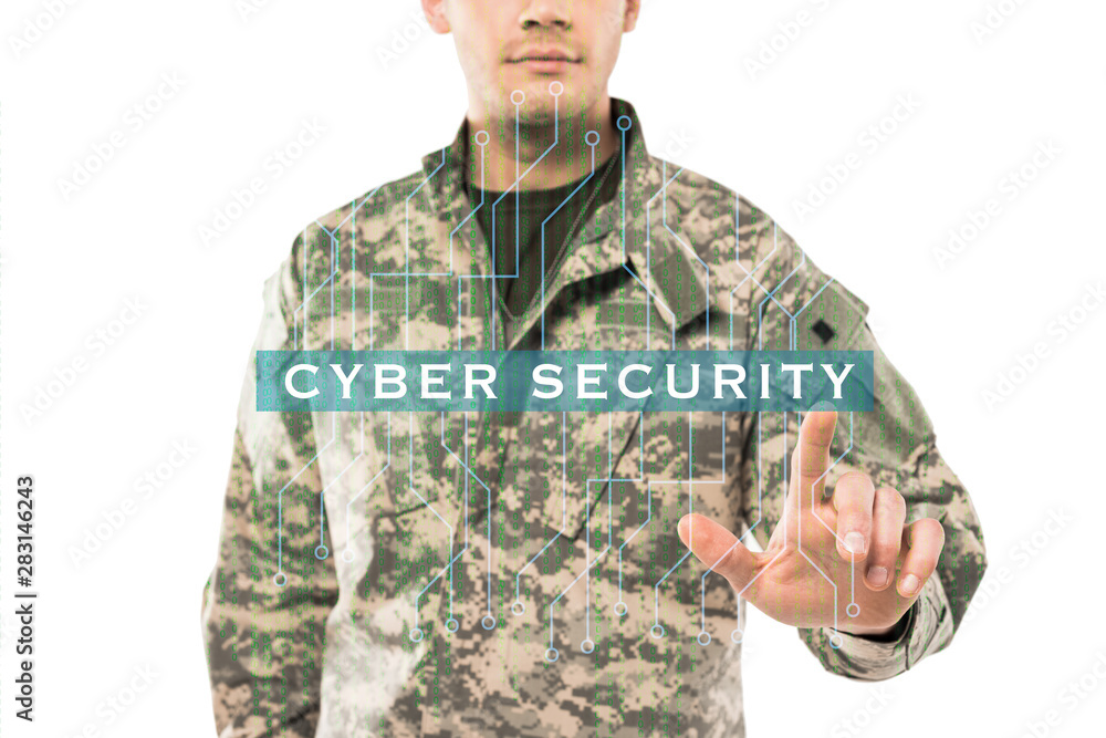 Cropped view of soldier in uniform pointing with finger at cyber security lettering on white Cropped view of soldier in uniform pointing with finger at cyber security lettering on white