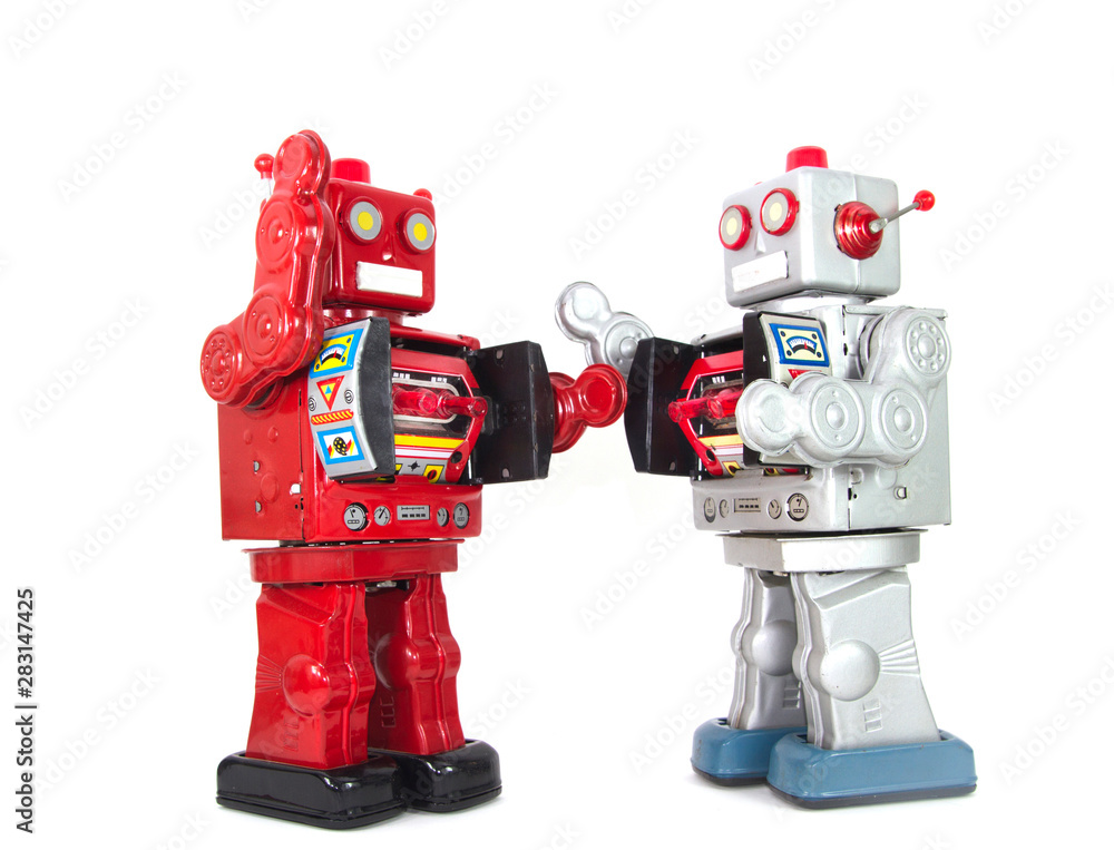 two retro robots high five each other isolated two retro robots high five each other isolated