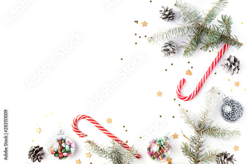 Christmas decorations. Christmas, winter, new year concept. Fir tree branches, pine cones, xmas balls and decorations on white background. Flat lay, top view, copy space