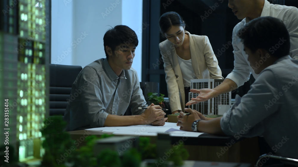 Fototapeta premium Business concept. Architects are working to fix the orders of customers outside of working hours.