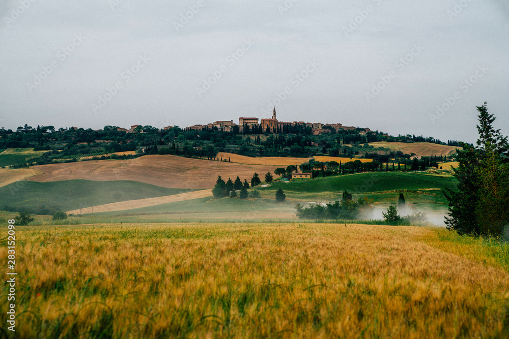 Beautiful landscape with old town on the background. One of the most famous places in Tuscany, Italy. Summer, holiday, traveling concept. Beautiful landscape with old town on the background. One of the most famous places in Tuscany, Italy. Summer, holiday, traveling concept.
