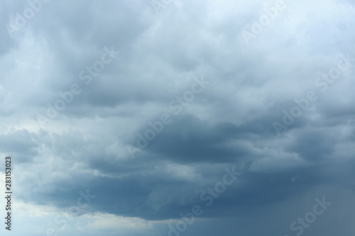 Sky with heavy rainy clouds on grey day