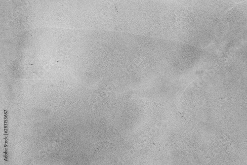 Texture of a concrete wall with cracks and scratches which can be used as a background