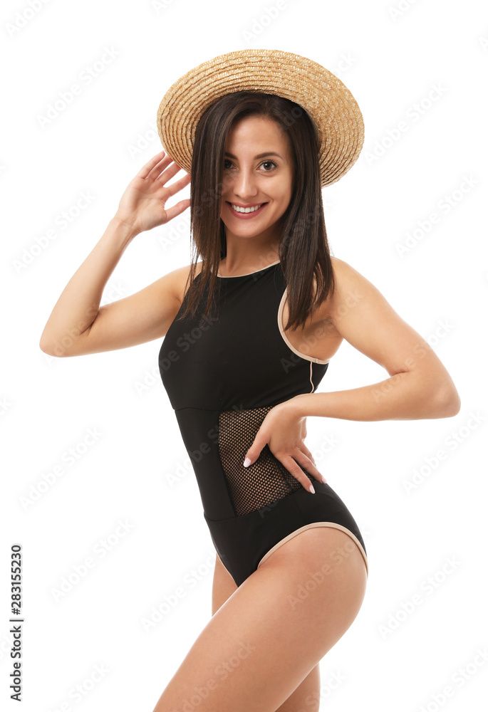 Pretty sexy woman with slim body in stylish black bikini on white background