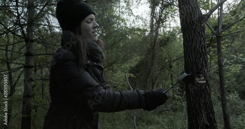 Woman Exhausted From Cutting Tree