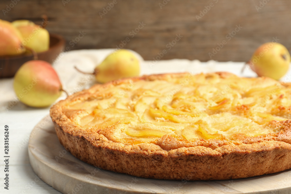 Delicious sweet pear tart on white table Delicious sweet pear tart on white table
